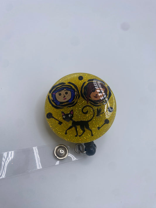 Button Eyes Badge Reel